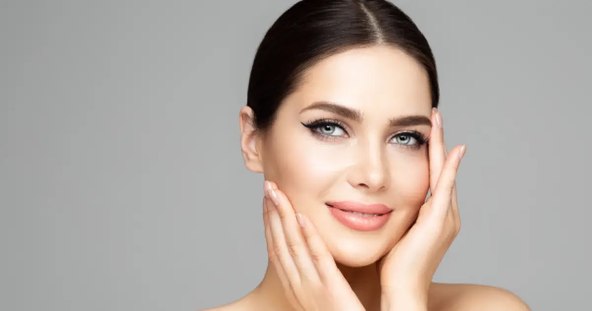 Smiling woman with clear, healthy skin, representing the results of SKINVIVE IN PORTSMOUTH, NH